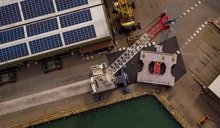 Drone video of heavy cargo lifting at Portico Shipping