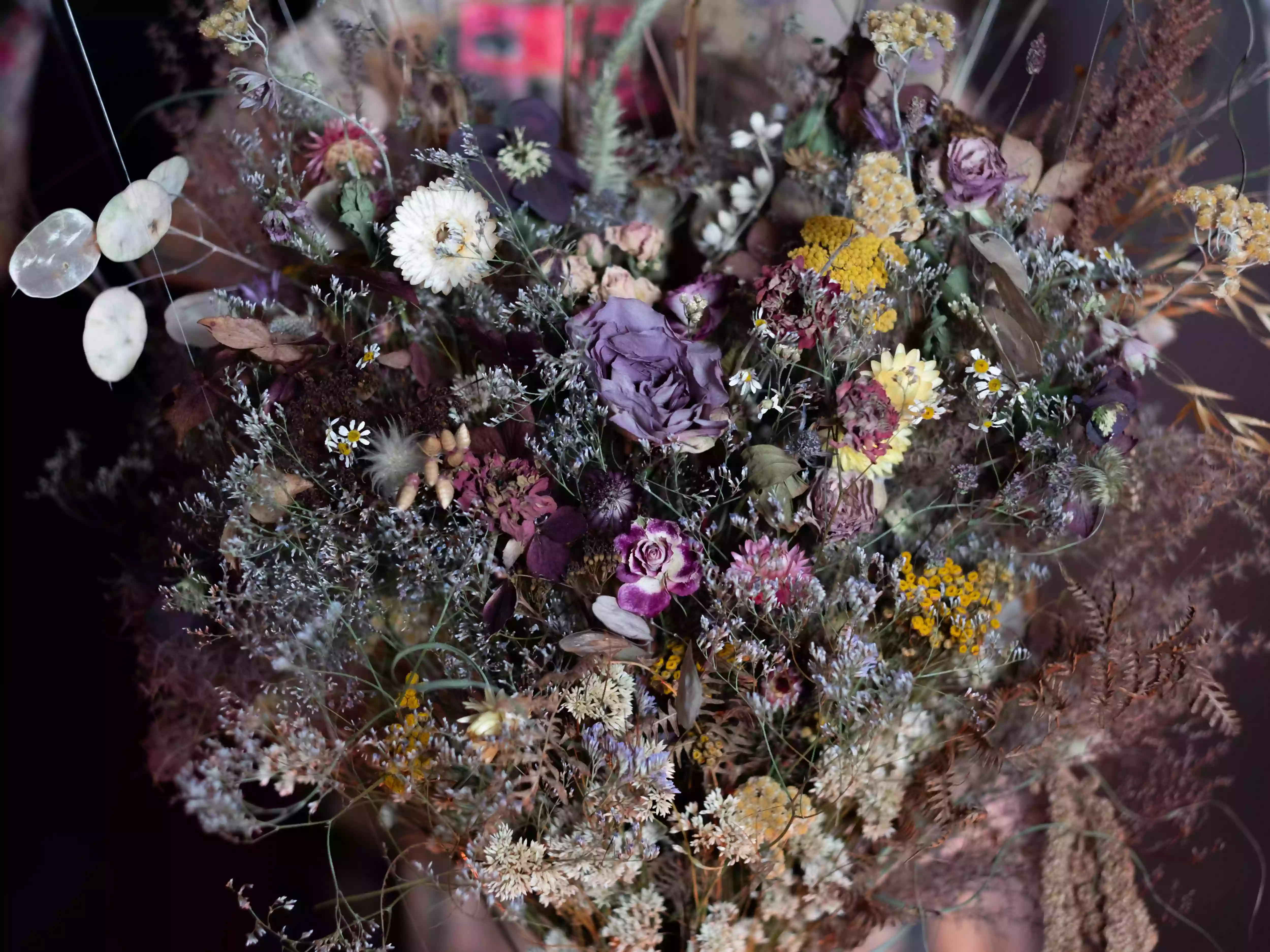 Floral arrangements by Sally Biloshiskaya surrounding the central paper dress