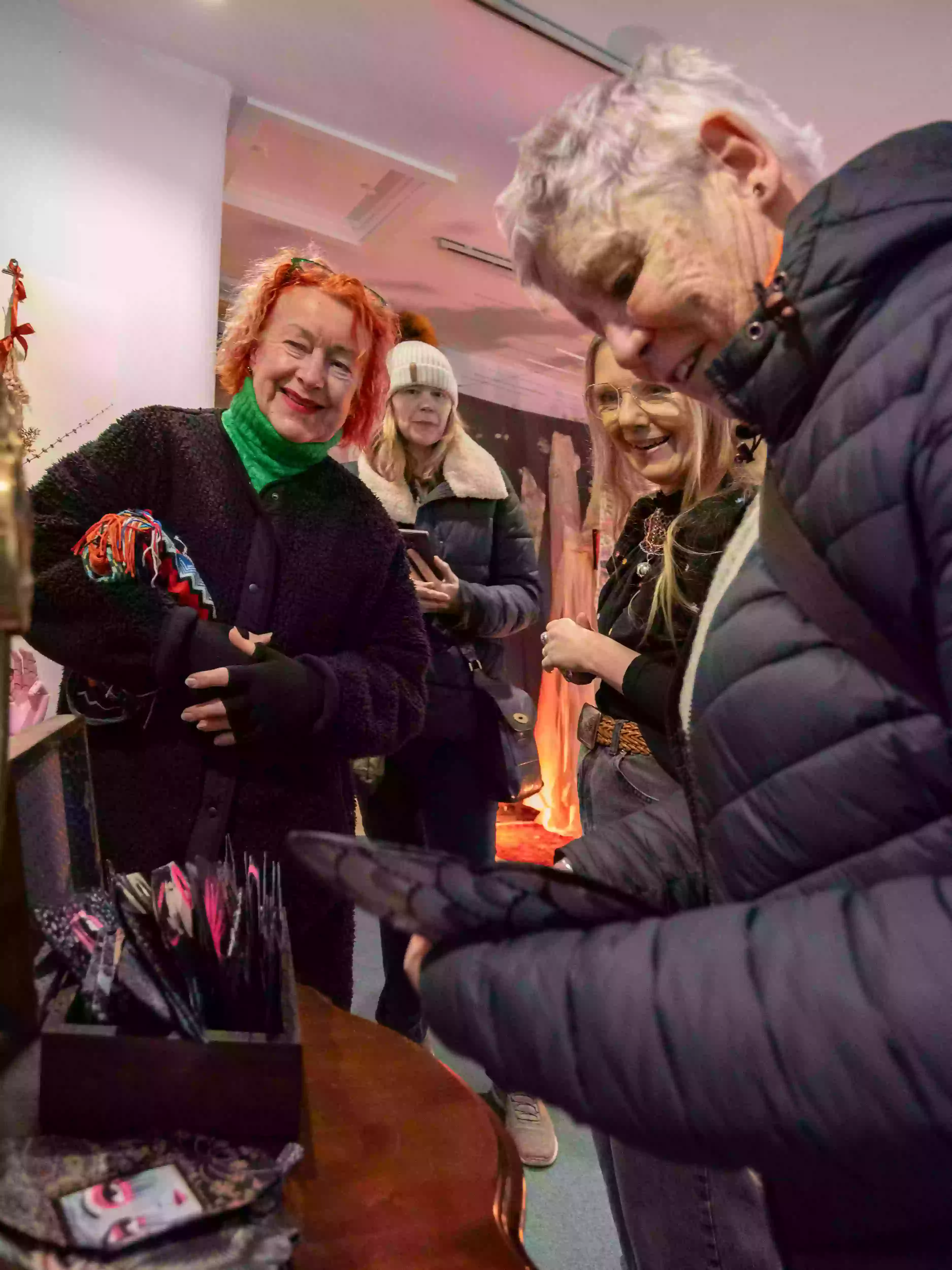 Visitors interacting with the painted butterflies in Roo Abrook's installation