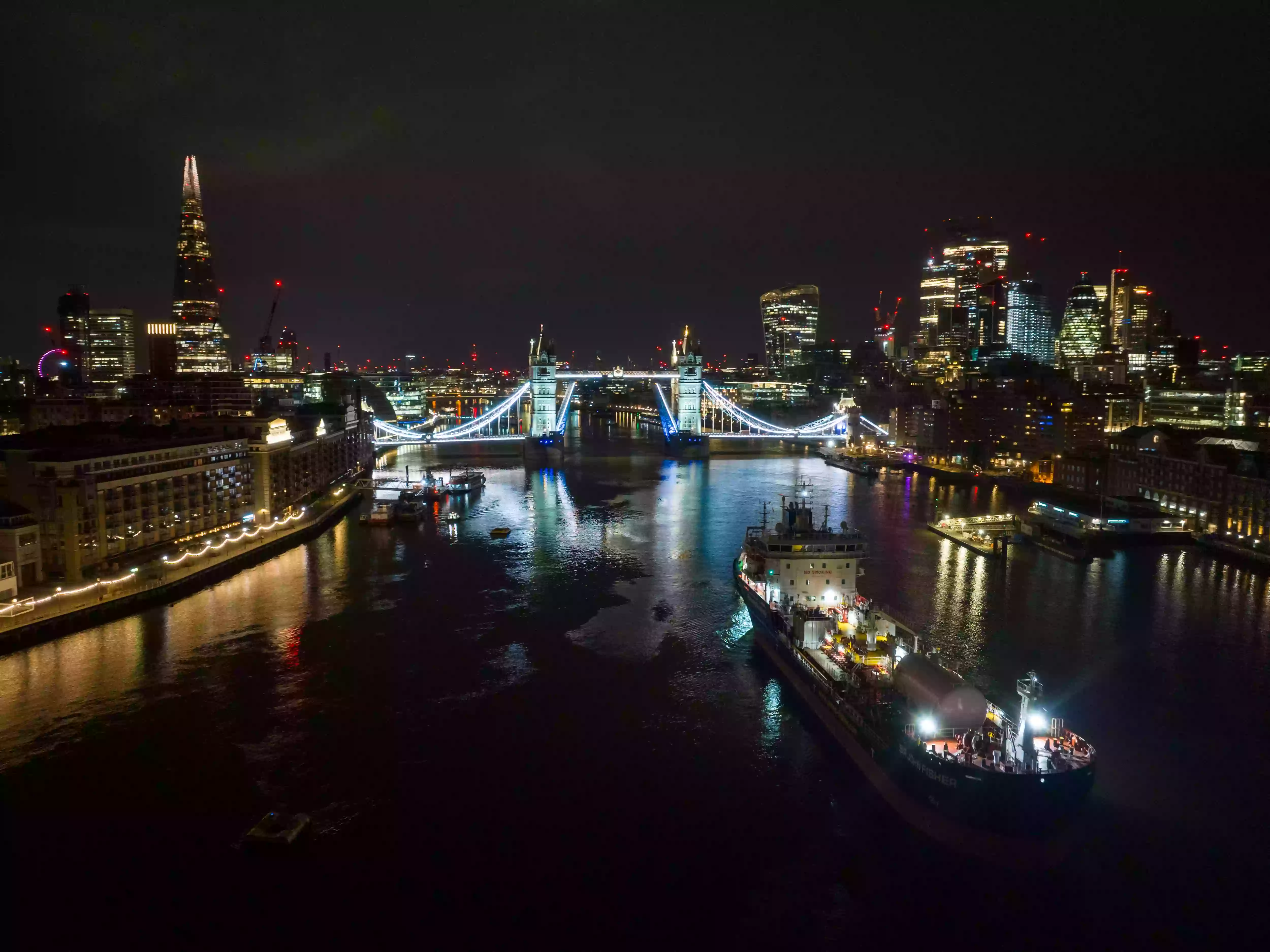 Sir John Fisher chemical tanker moored alongside HMS Belfast in the Pool of London for her naming ceremony