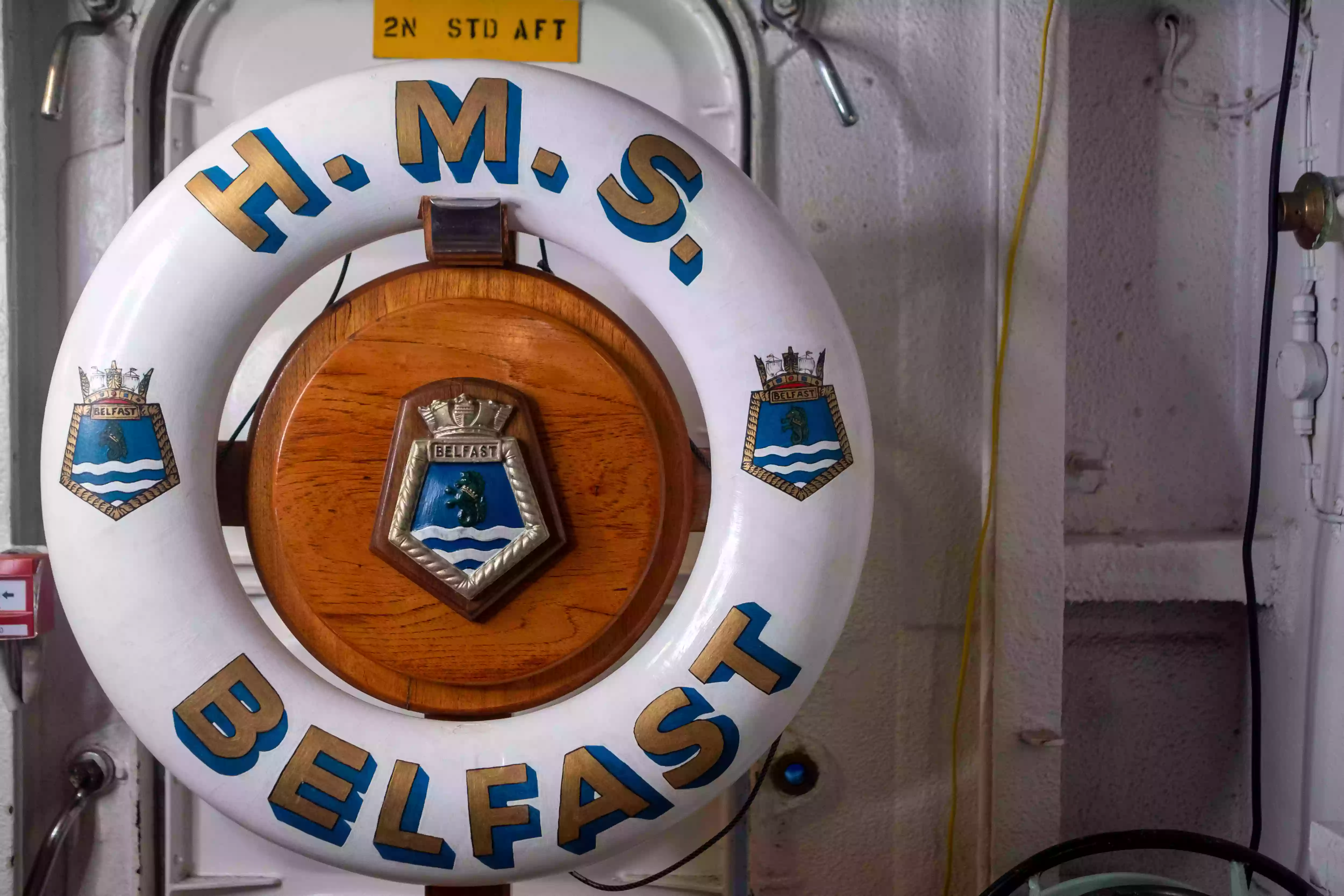 HMS Belfast lifebuoy on deck during the Sir John Fisher naming ceremony in the Pool of London