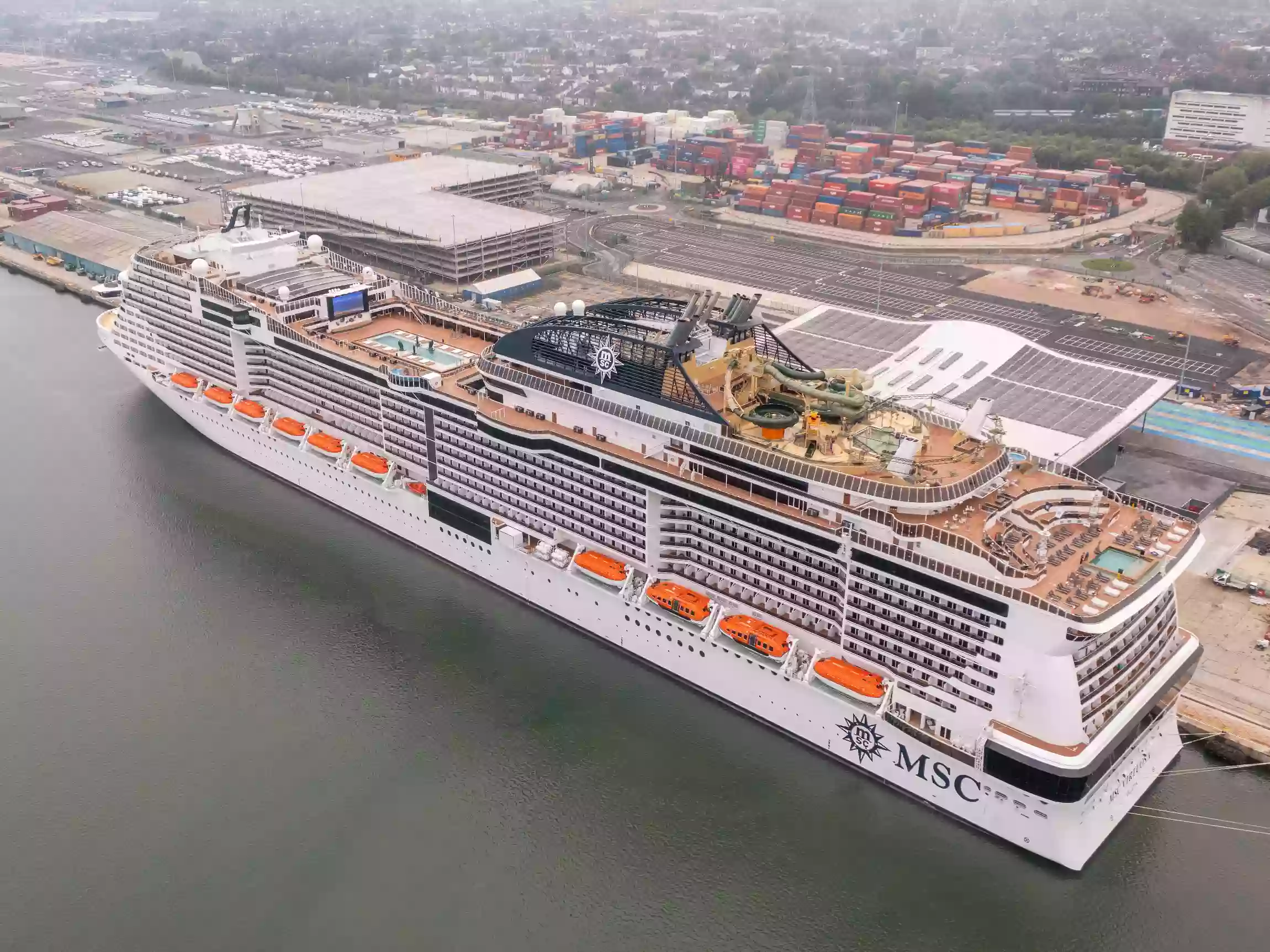 Wide aerial view of MSC Virtuosa at Horizon Cruise Terminal during her historic first call at the port.