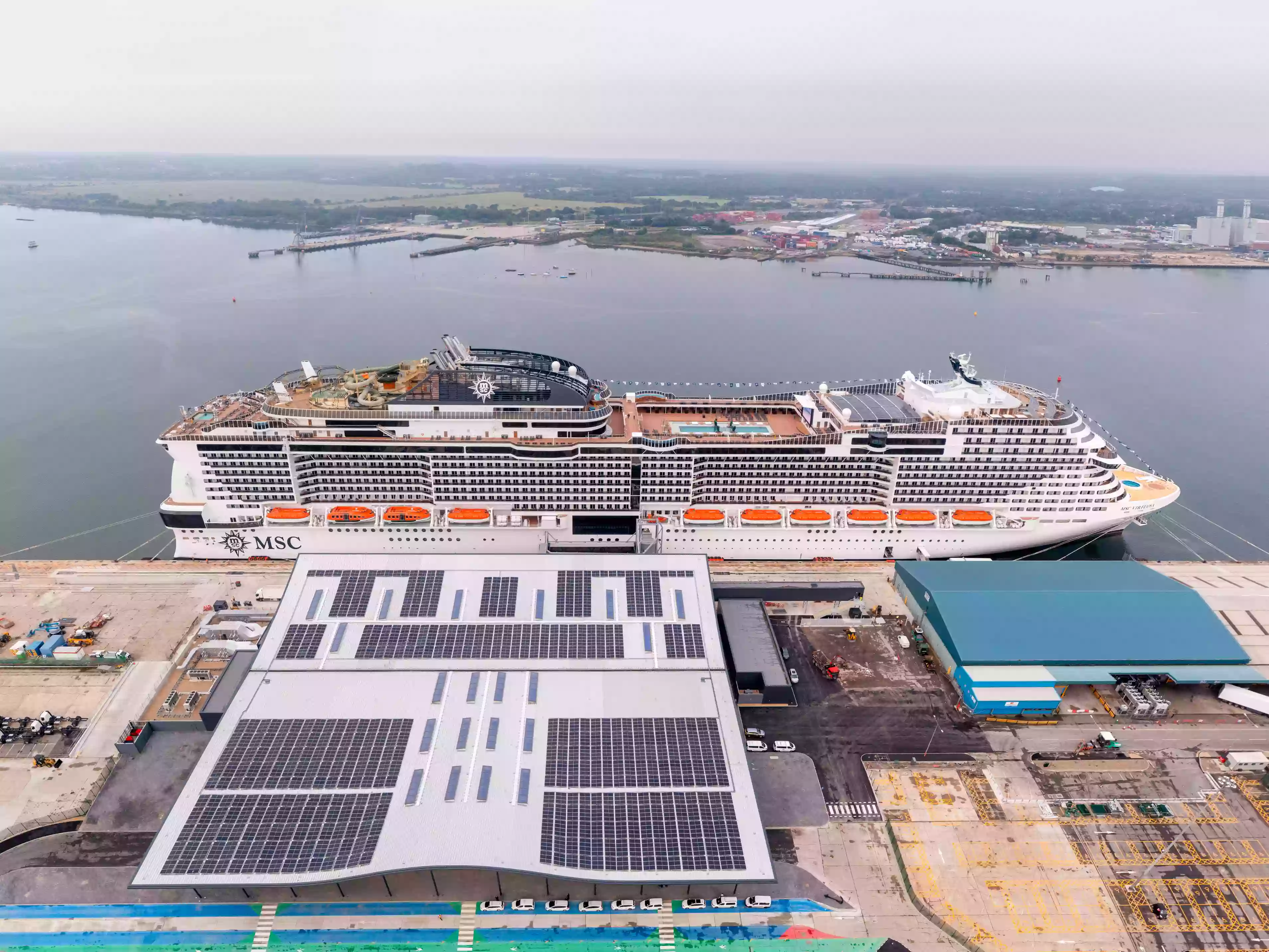 Exterior of the Horizon Cruise Terminal in Southampton, showing its rooftop solar panels and modern facade.