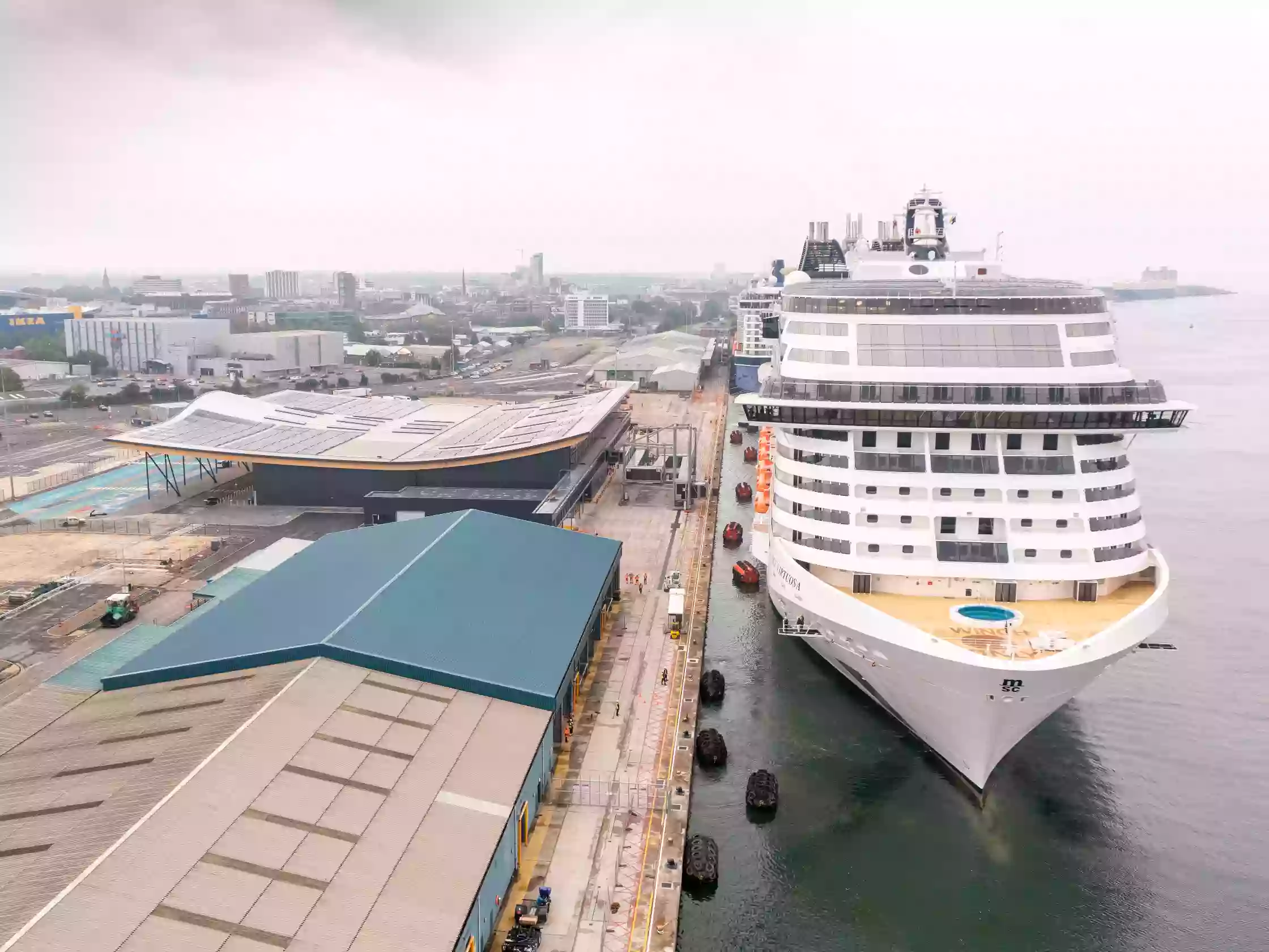 MSC Virtuosa's hull and superstructure seen from the quayside at the Port of Southampton's Horizon Cruise Terminal.