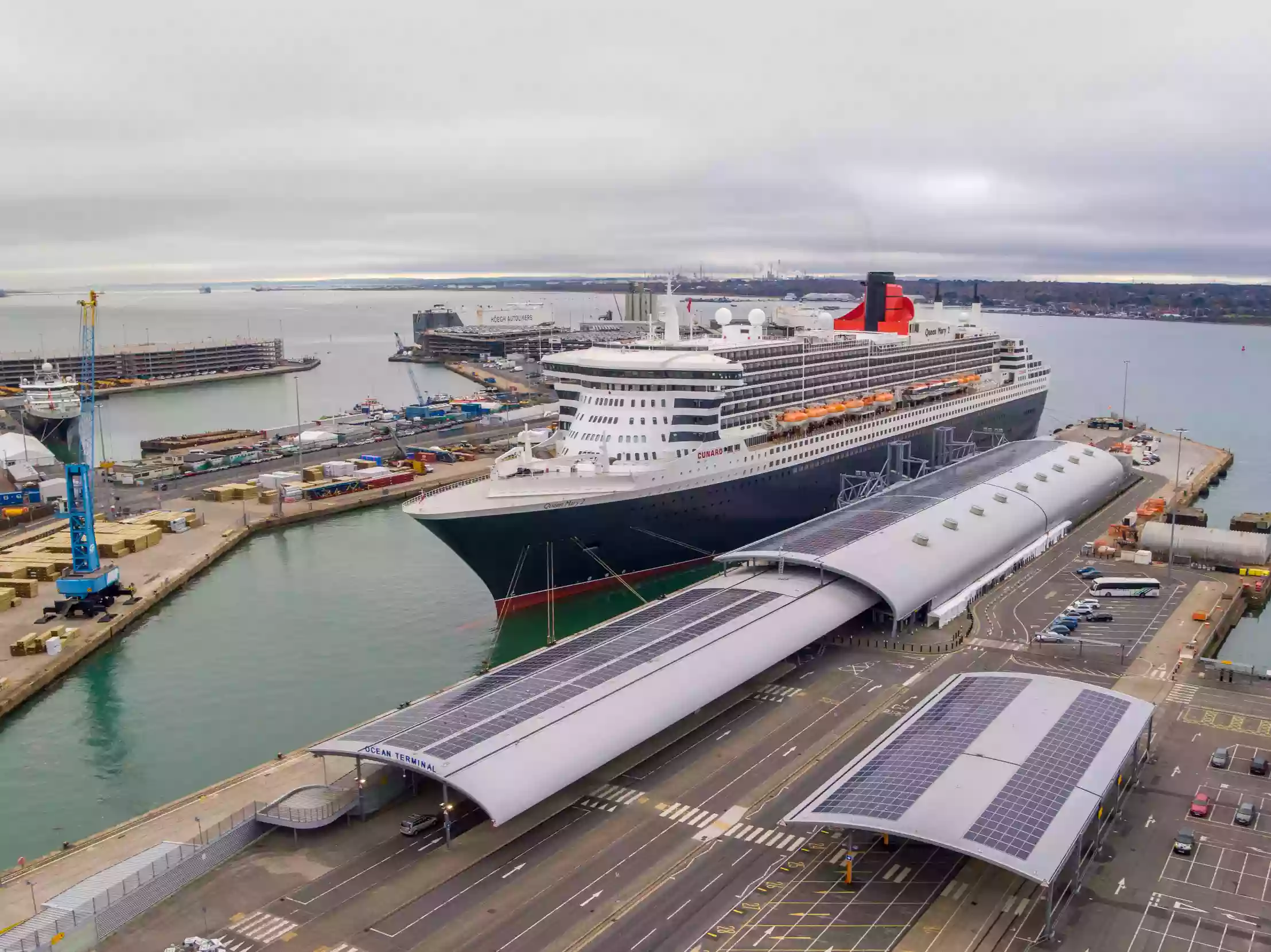 Aerial view of a cruise ship alongside the cruise terminal at the Port of Southampton.