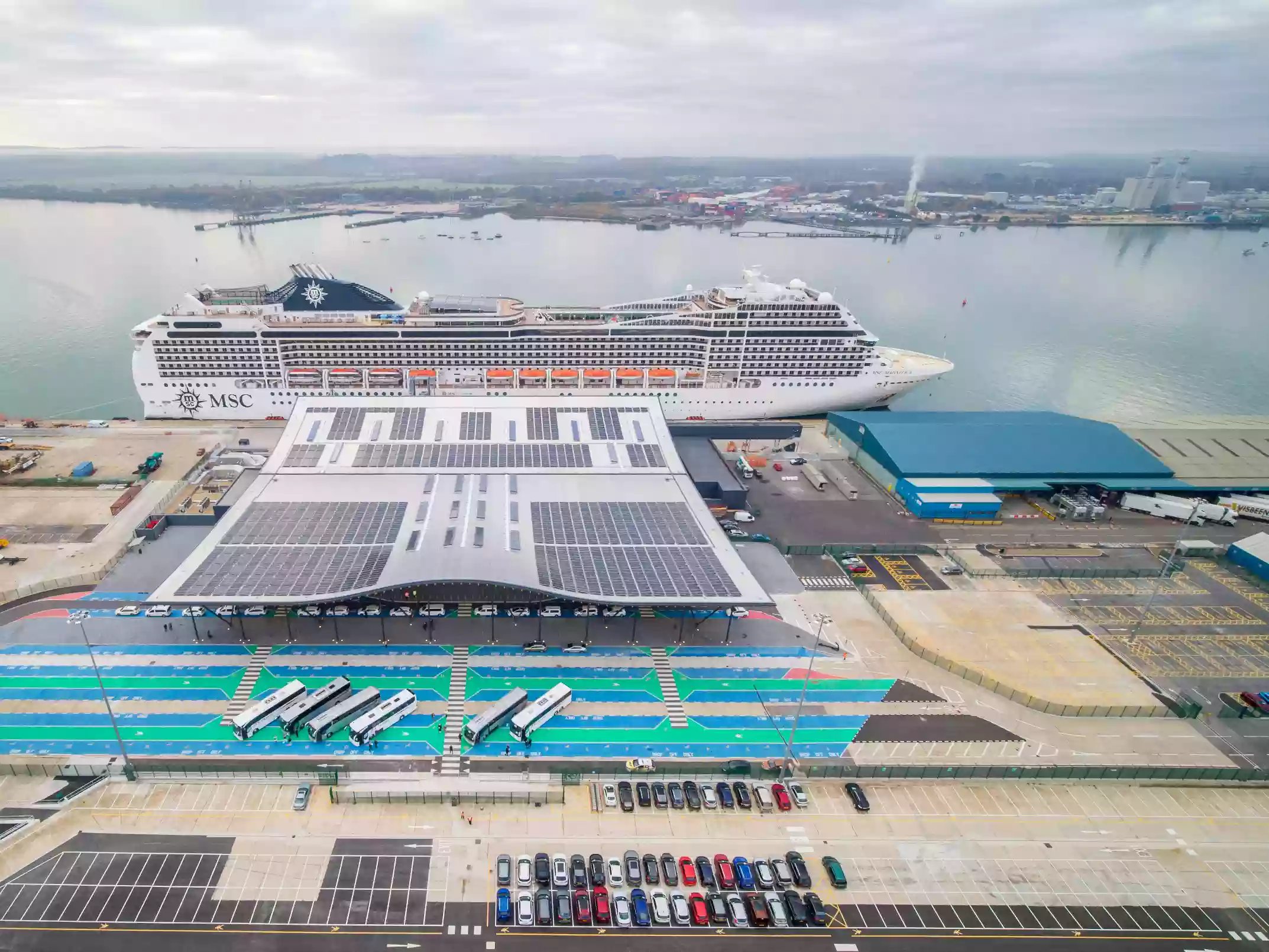 Overhead aerial view of solar-panelled cruise terminal rooftops at the Port of Southampton.