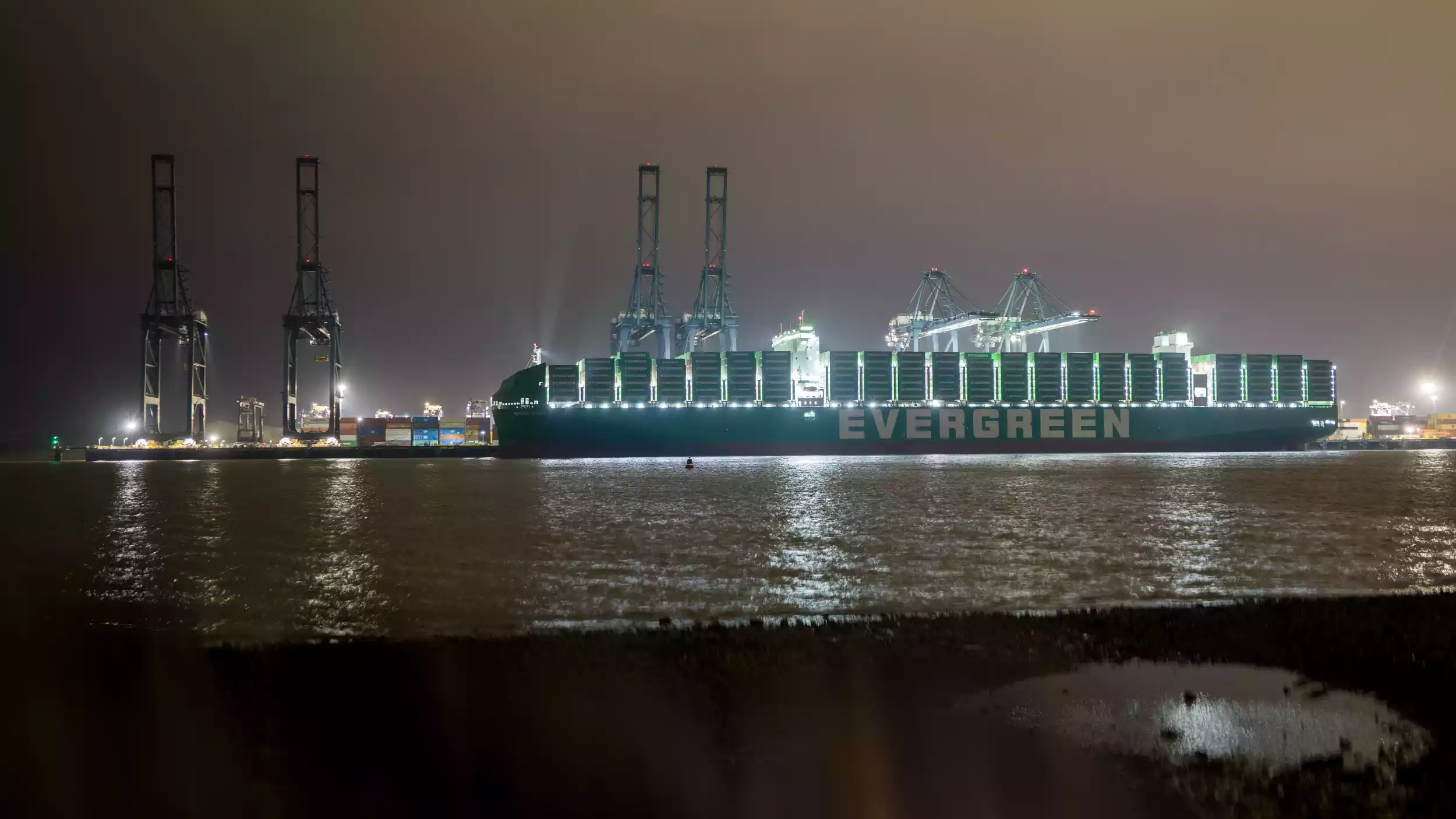 Aerial view of Ever Eco container ship approaching Port of Felixstowe at dusk