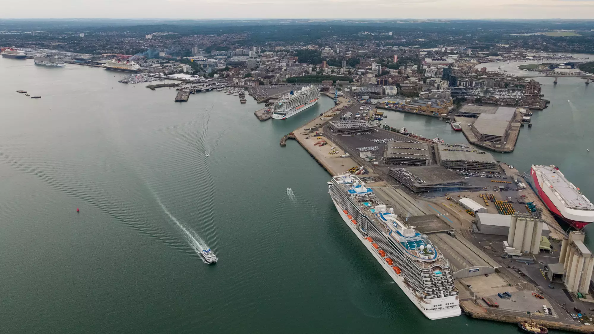 Aerial view of cruise ships berthed at the Port of Southampton with the city behind