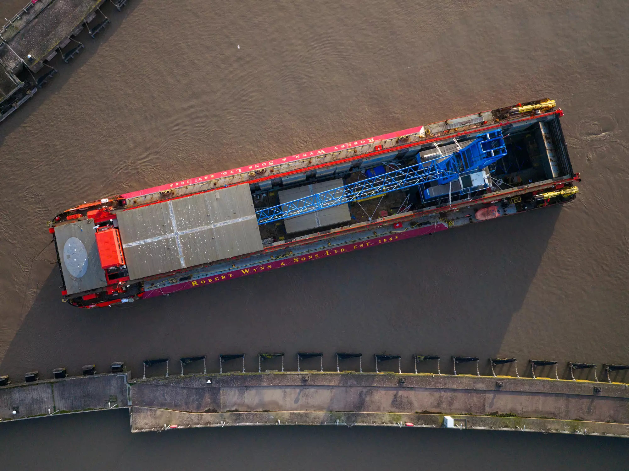 Drone footage of crane Margaret arriving by barge at ABP Port of Newport from Southampton