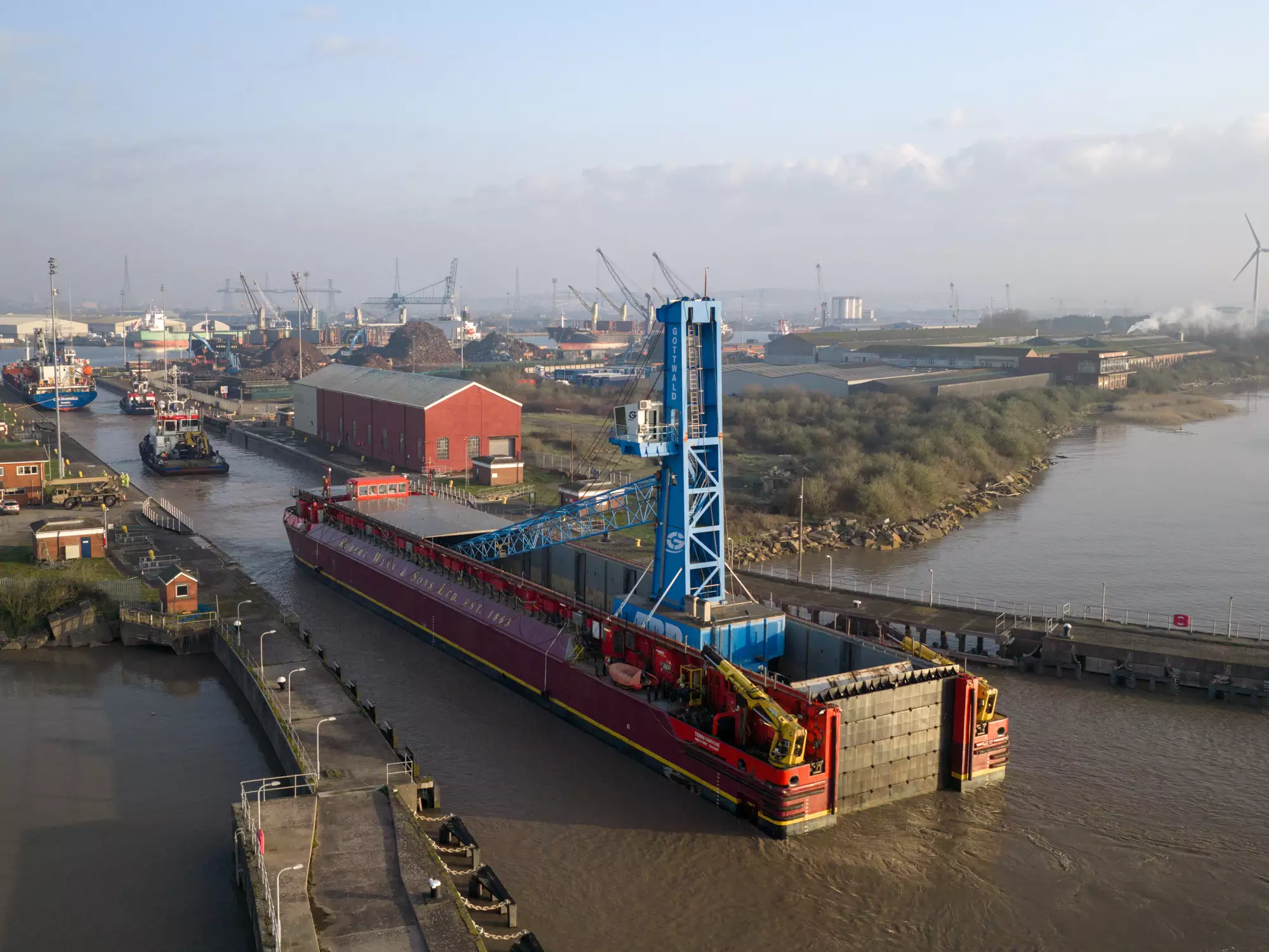 Drone photo of the Robert Wynn and Sons barge carrying crane Margaret into the Port of Newport