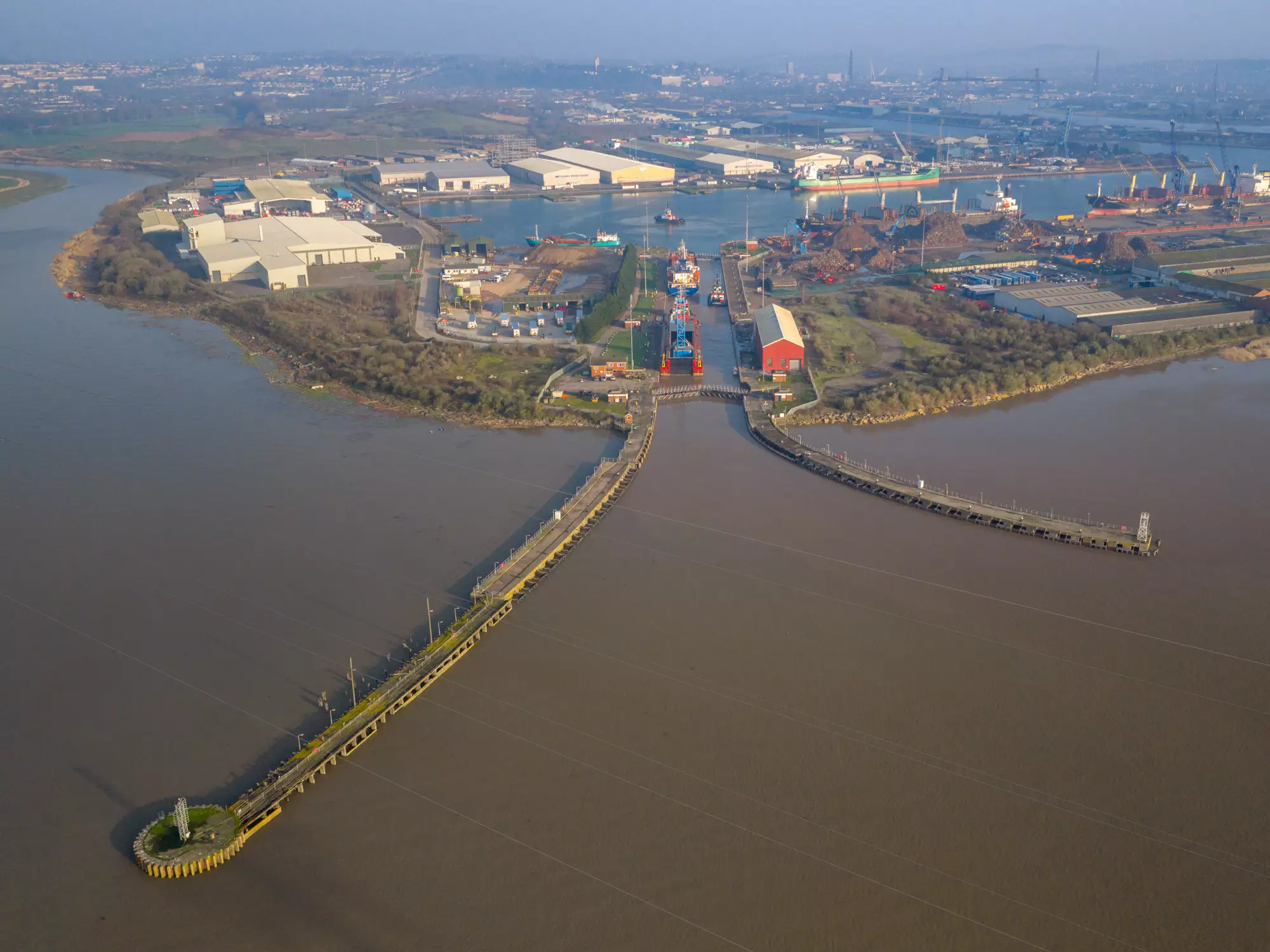 Aerial view of the Robert Wynn and Sons barge carrying crane Margaret into the Port of Newport