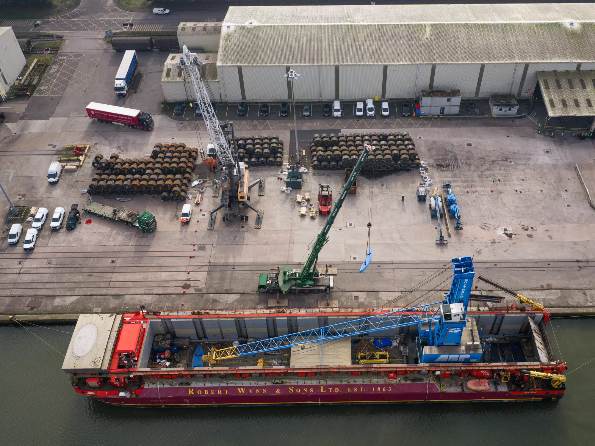 King Lifting heavy lift of quayside crane Margaret at ABP Newport, filmed from the air
